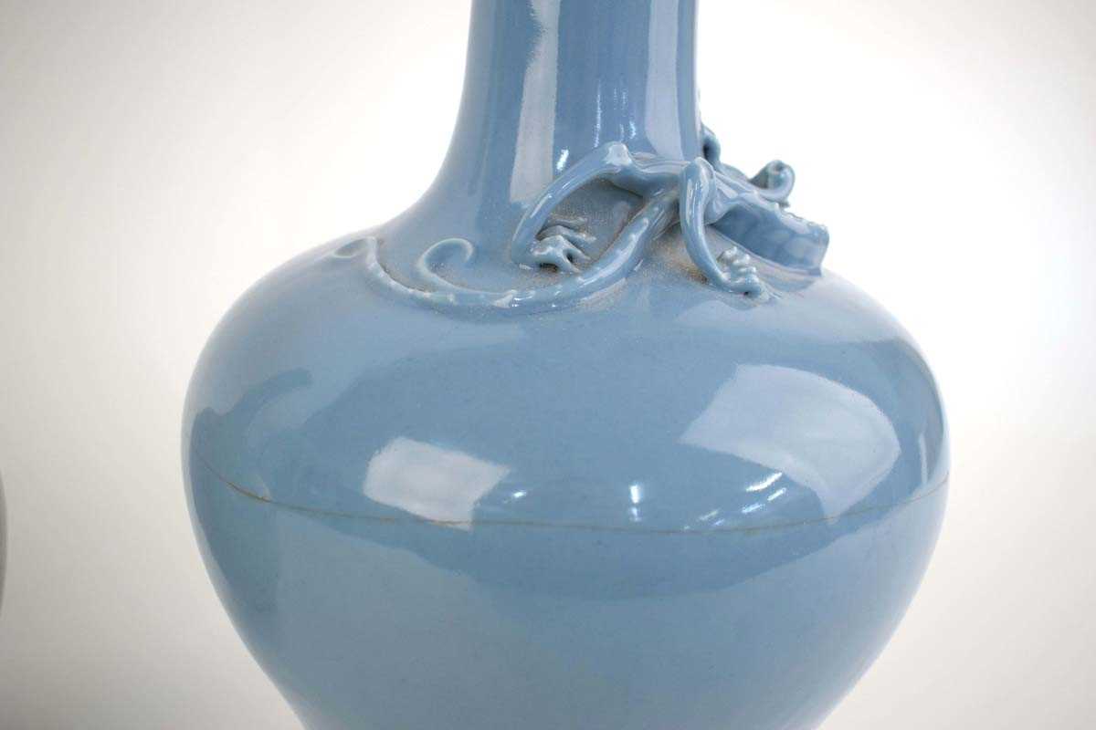 A Chinese pale blue glazed bottle vase relief decorated with an outstretched dragon, h. 39 cm, d. 20 - Image 3 of 16