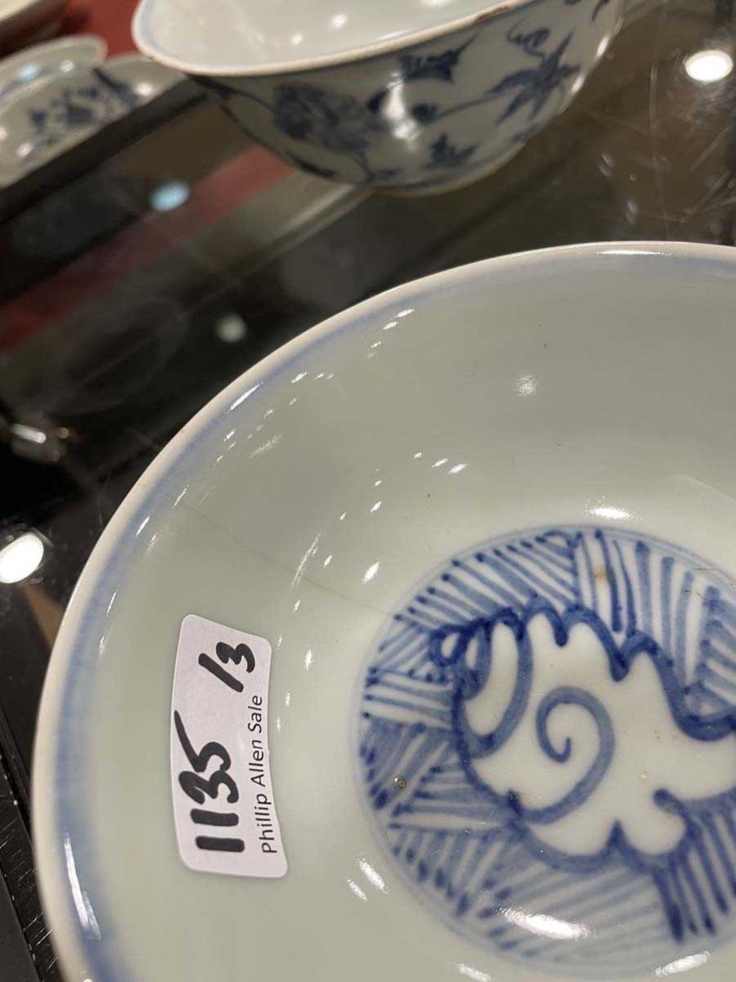 A Chinese blue and white bowl of flared form, externally decorated with scrolls of stylised - Image 15 of 22