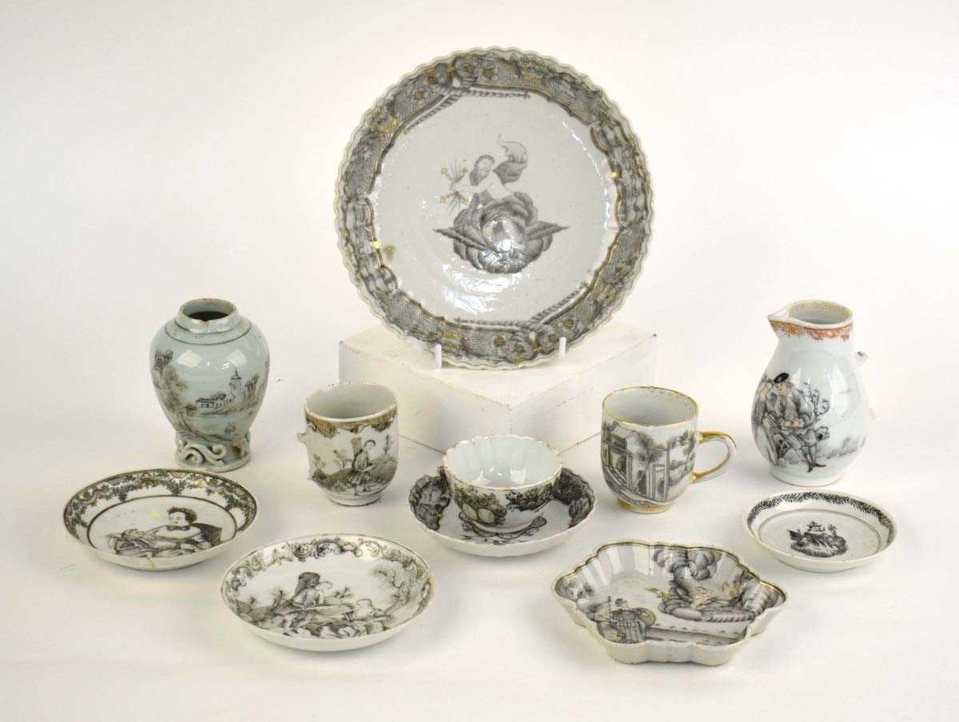 Eleven items of Chinese en-grisaille decorated porcelain including a tea bowl and matching saucer,