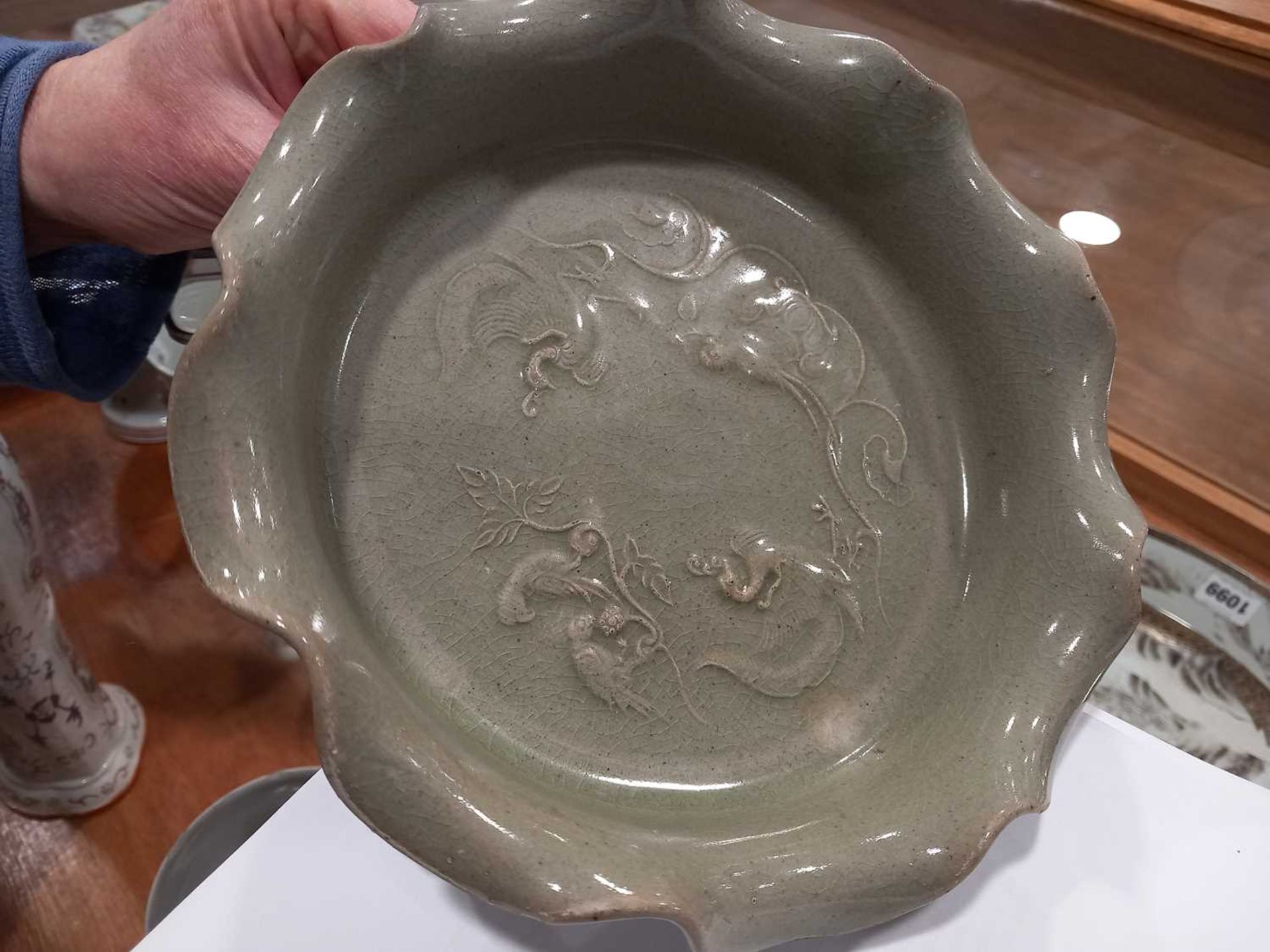 A Chinese celadon dish of scalloped circular form, relief decorated with exotic birds on three - Bild 7 aus 10