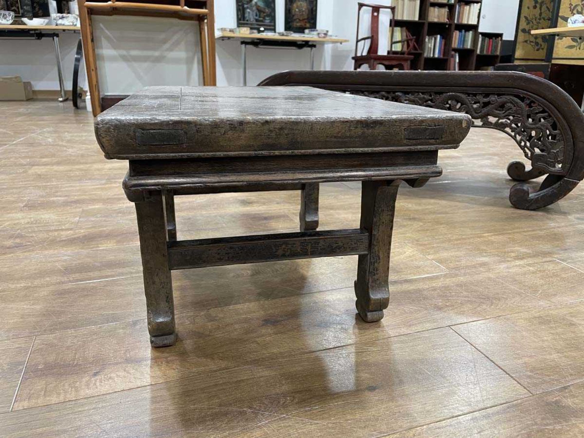 A Chinese low elm side table, the surface over a frieze on four shaped legs, 64 x 35 x 31 cm, - Bild 6 aus 15