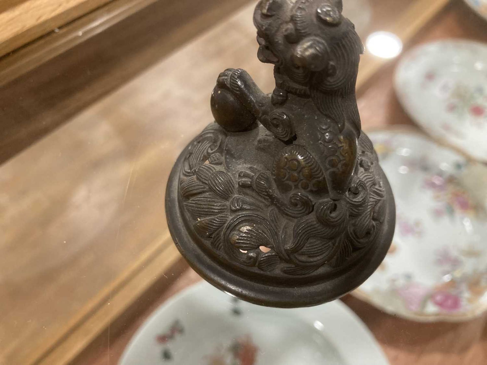 A 19th century Chinese bronze incense burner decorated with key motifs and having three ring handles - Image 30 of 33
