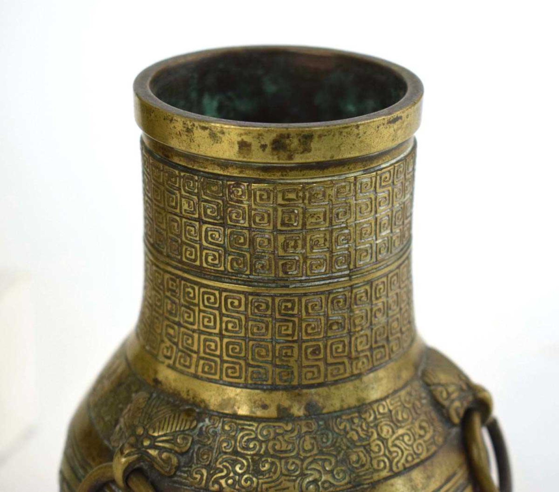 A 19th century Chinese bronze incense burner decorated with key motifs and having three ring handles - Image 4 of 33