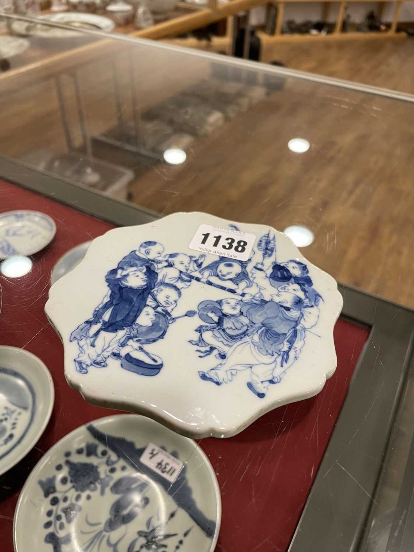 A Chinese blue and white plaque of flowerhead form decorated with children at play, set into a - Image 6 of 20