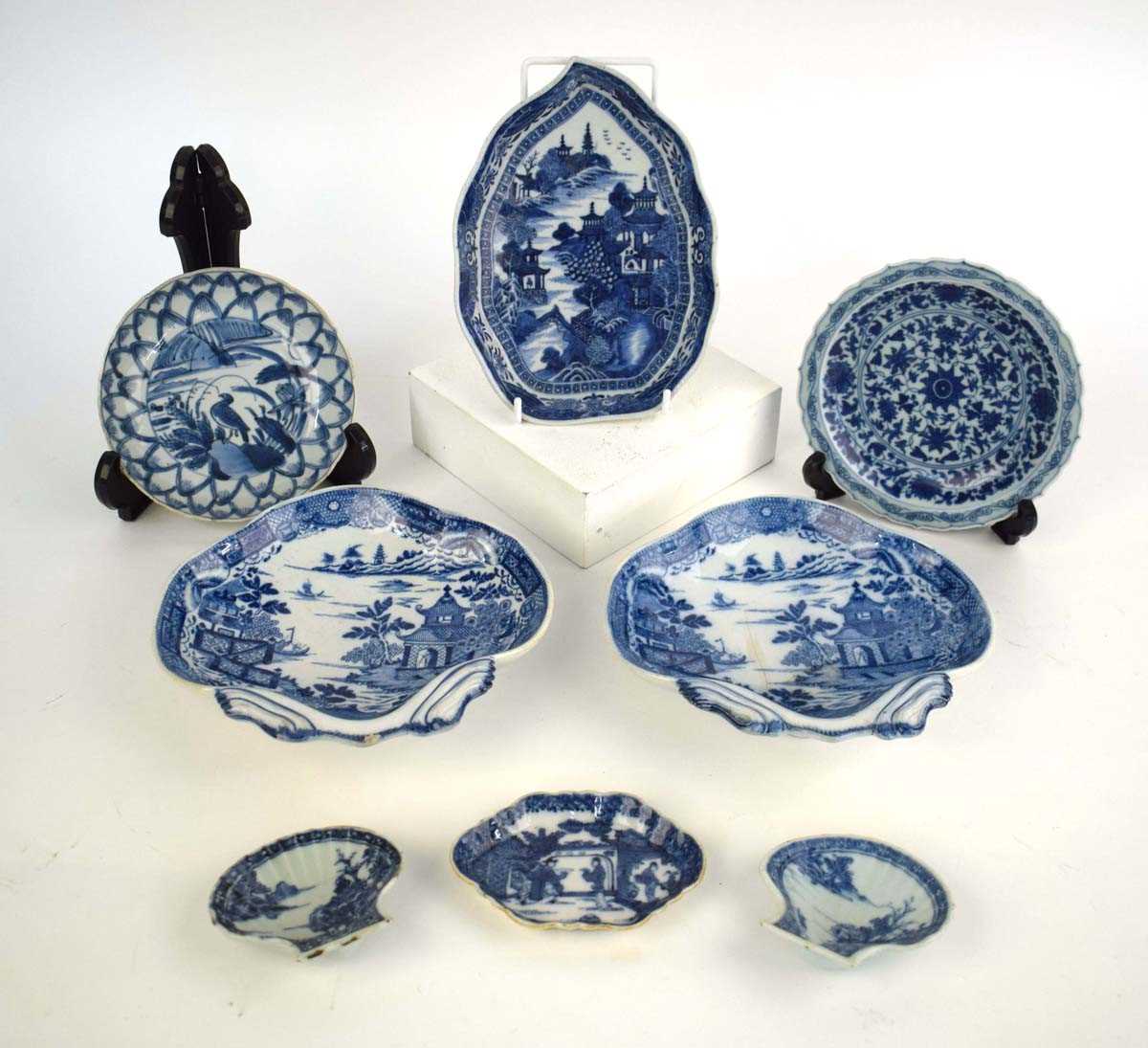 A Chinese blue and white leaf shaped dish decorated with an extensive landscape within a foliate