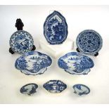 A Chinese blue and white leaf shaped dish decorated with an extensive landscape within a foliate