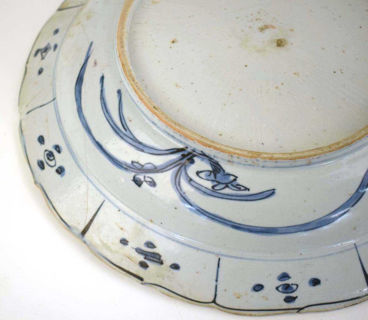 A Chinese blue and white shallow bowl of flowerhead form decorated with birds within foliate - Image 10 of 10