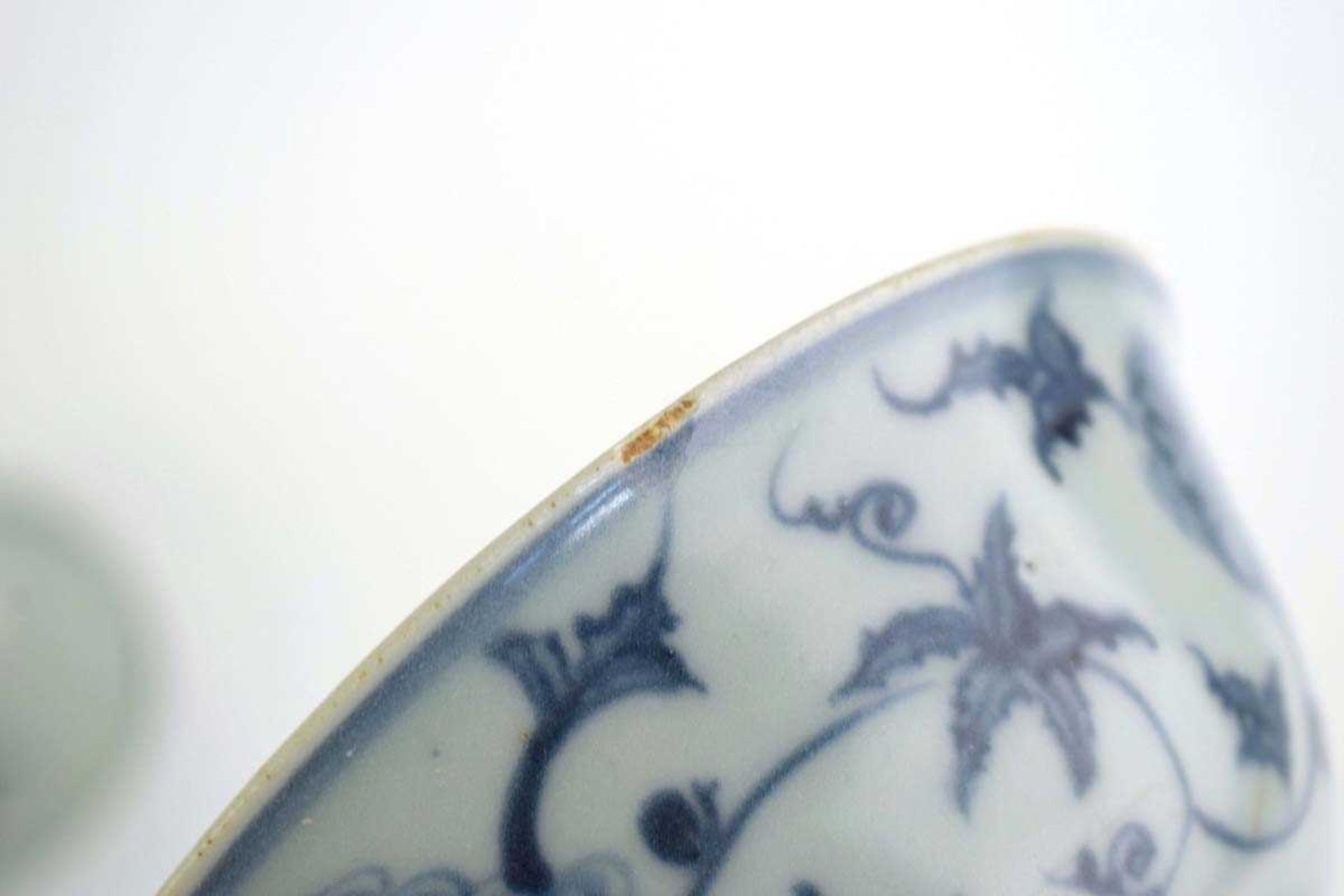 A Chinese blue and white bowl of flared form, externally decorated with scrolls of stylised - Image 7 of 22