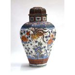 A Chinese covered jar of shouldered octagonal form decorated in the imari palette with exotic