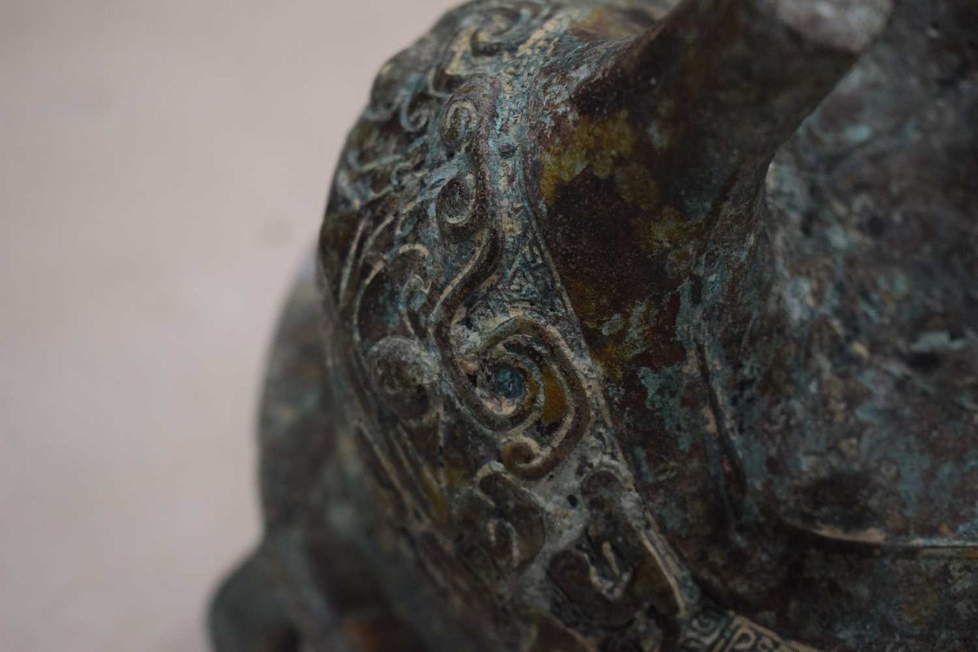 A Chinese green patinated bronze incense burner of archaic form, the triform base decorated with - Image 21 of 29