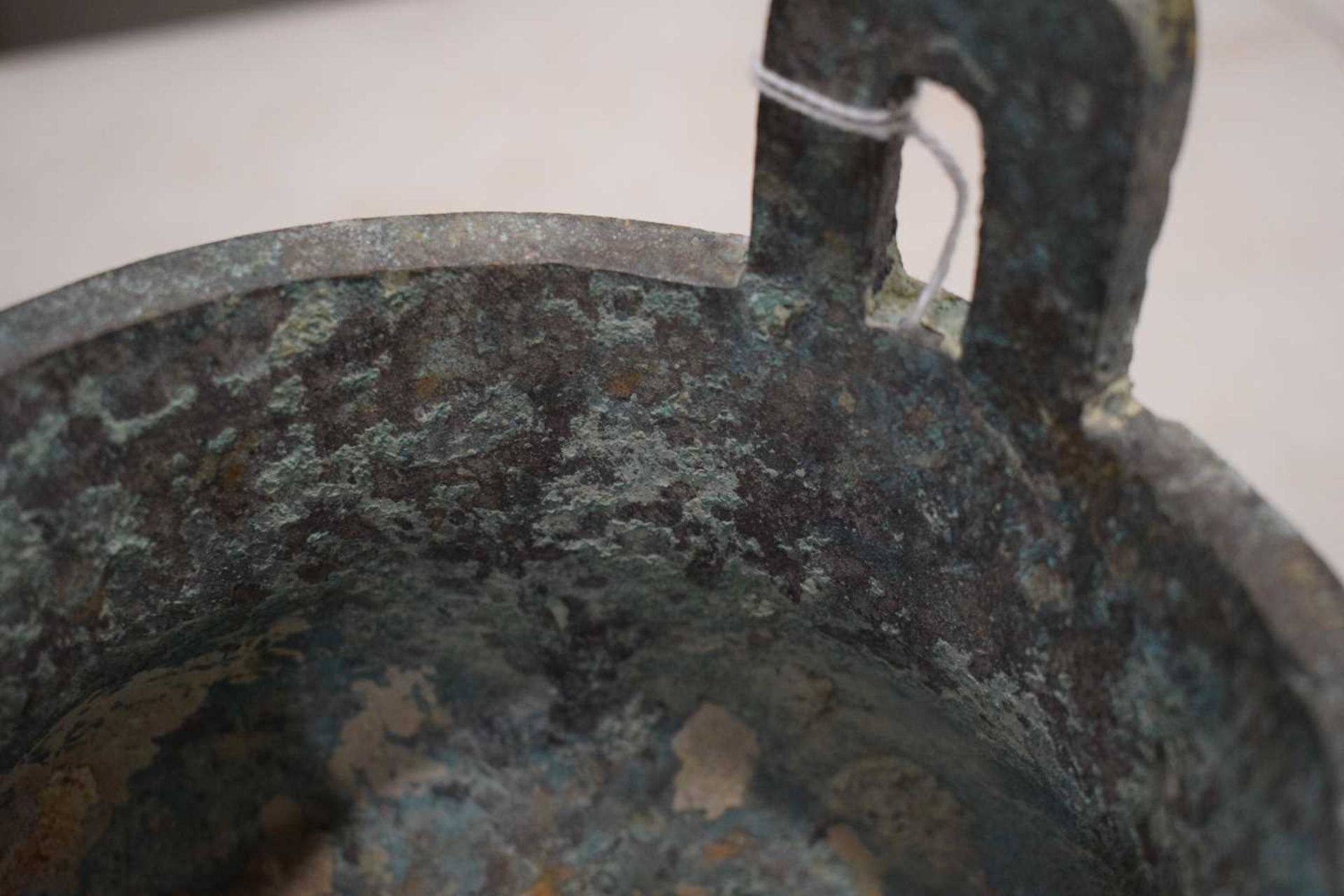 A Chinese green patinated bronze incense burner of archaic form, the triform base decorated with - Image 22 of 29
