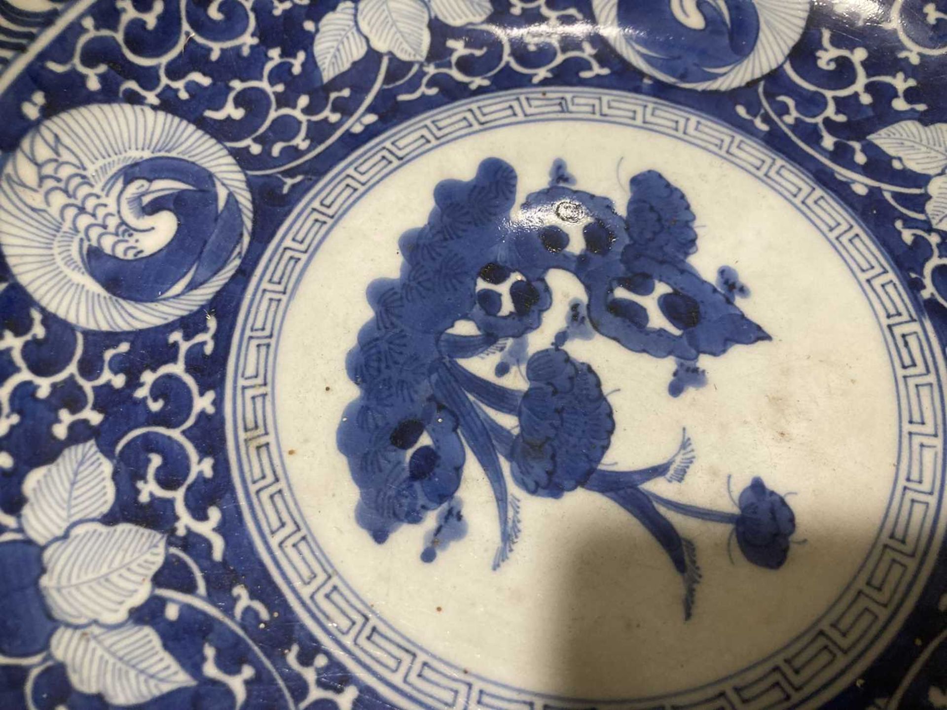 A Japanese blue and white bowl, centrally decorated with a shrubs within a scrolled border, - Image 12 of 12