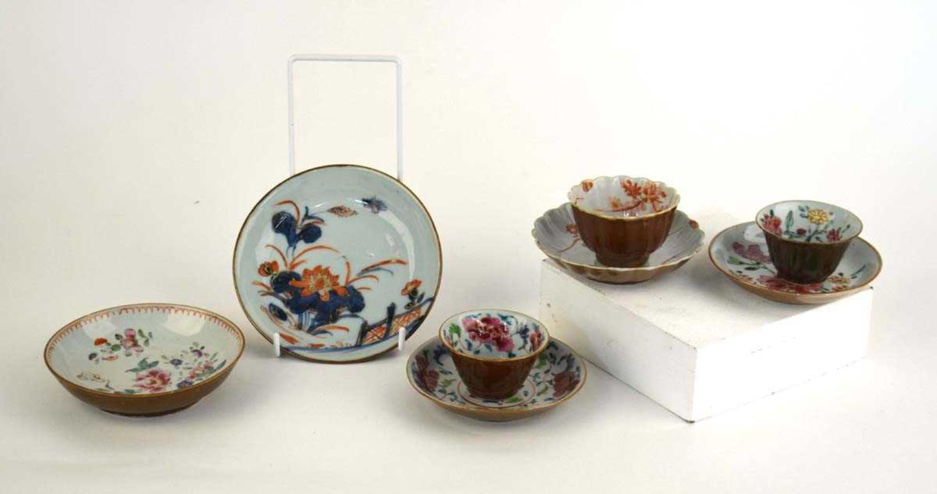 Eight items of Batavia porcelain, each decorated with foliate motifs in coloured enamels including a