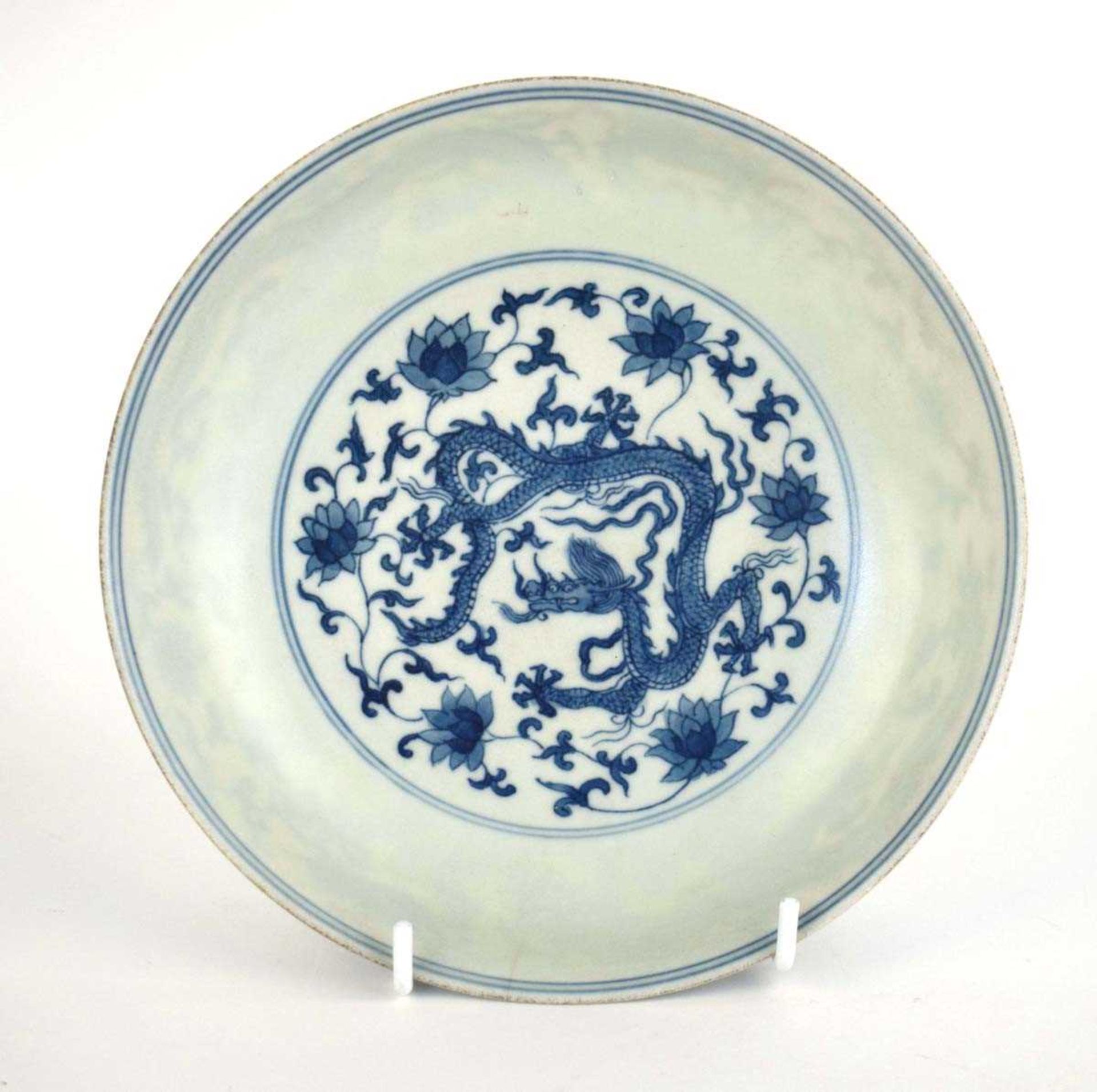 A Chinese blue and white shallow dish, centrally decorated with a dragon and lotus flowers, pseudo - Image 2 of 31