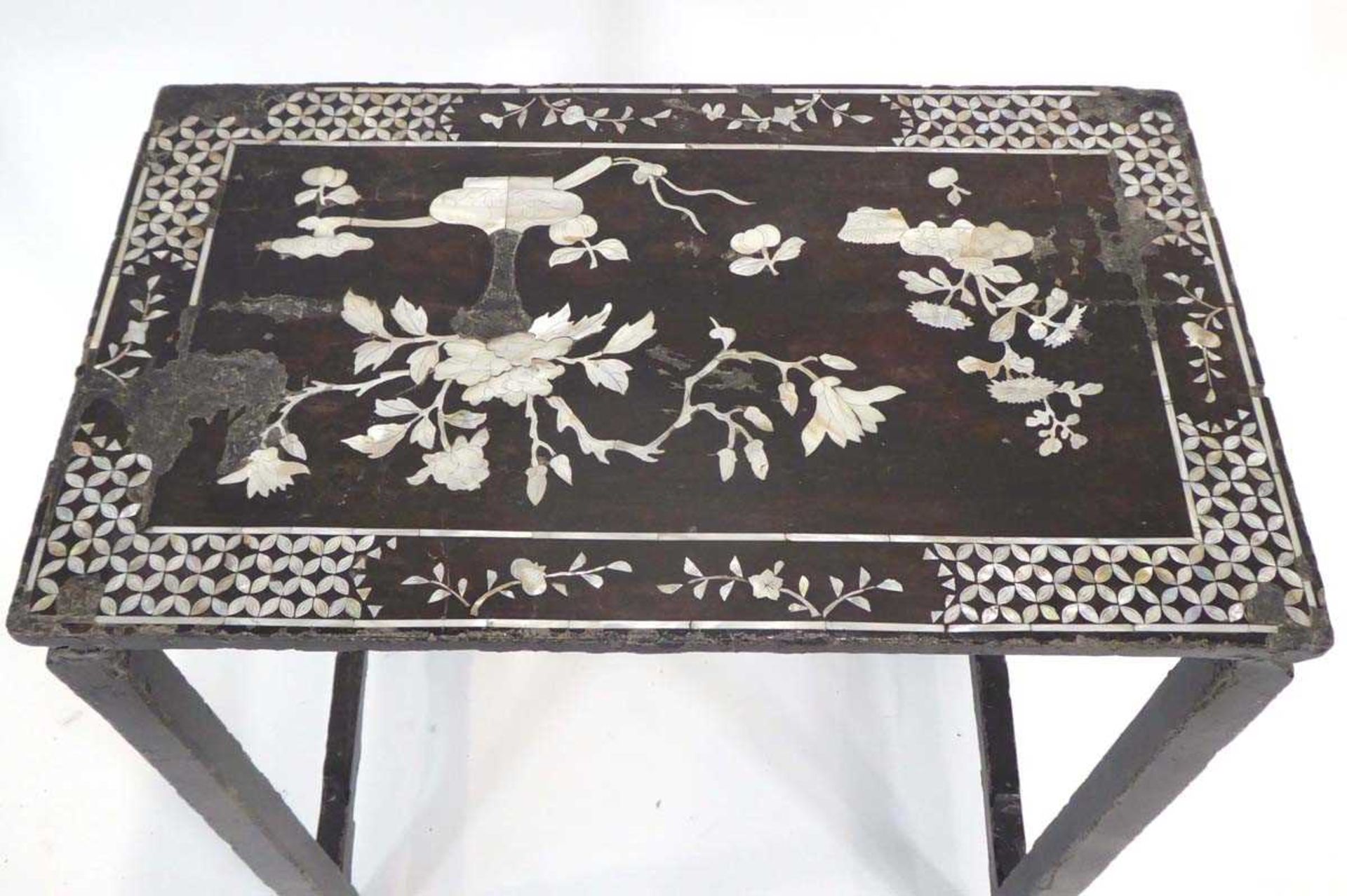A 19th century Chinese Export (?)huanghuali and lacquered nesting table inlaid with mother-of- - Image 3 of 3