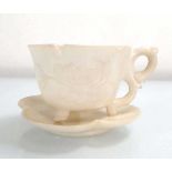 A Chinese carved white stone tea cup and saucer of lotus flower design, cup h. 4.5 cm (2) *from