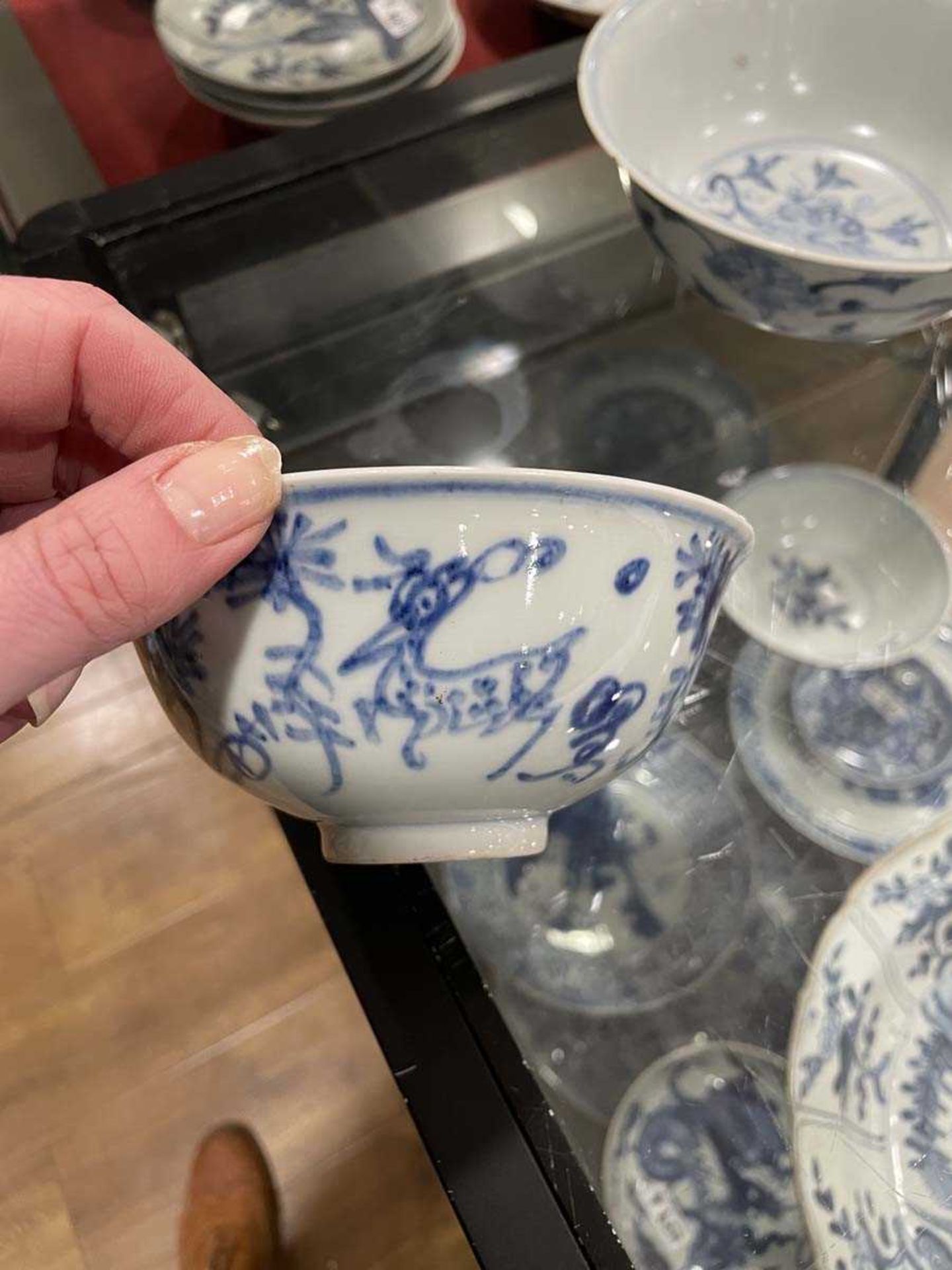 A Chinese blue and white bowl of flared form, externally decorated with scrolls of stylised - Image 17 of 22