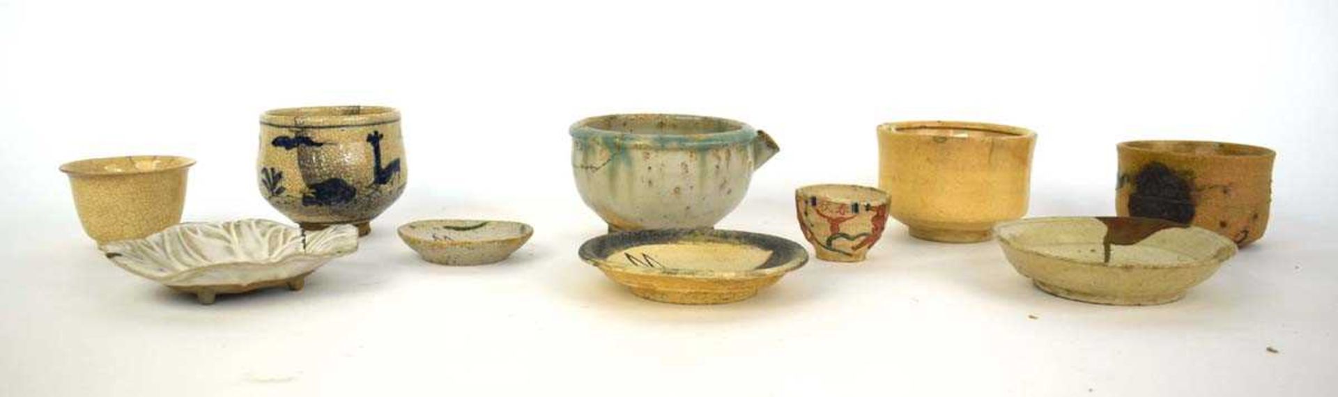 A Japanese Minoware dish, centrally decorated with a hare, d. 8 cm, together nine further items of