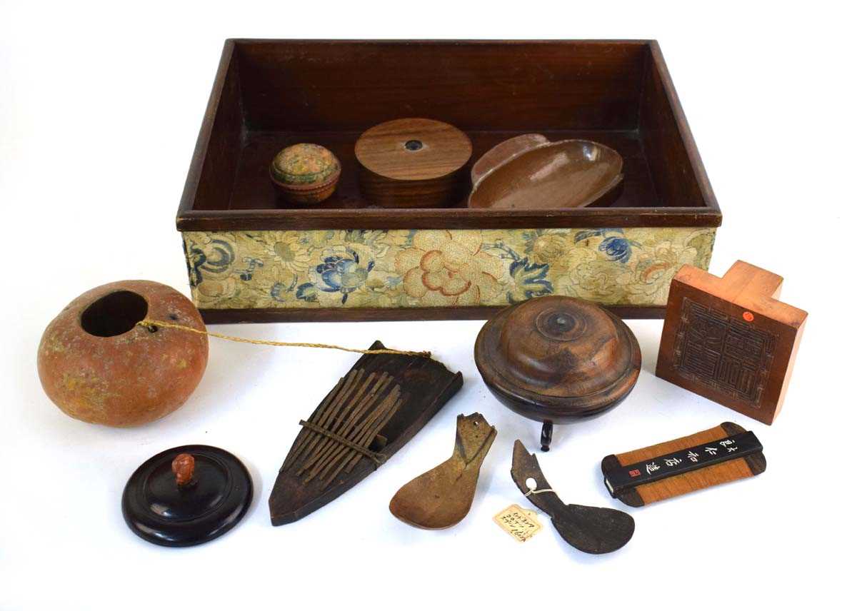 A mixed group of Oriental wooden collectables including a moustache comb, l. 12 cm, an ink stamp,