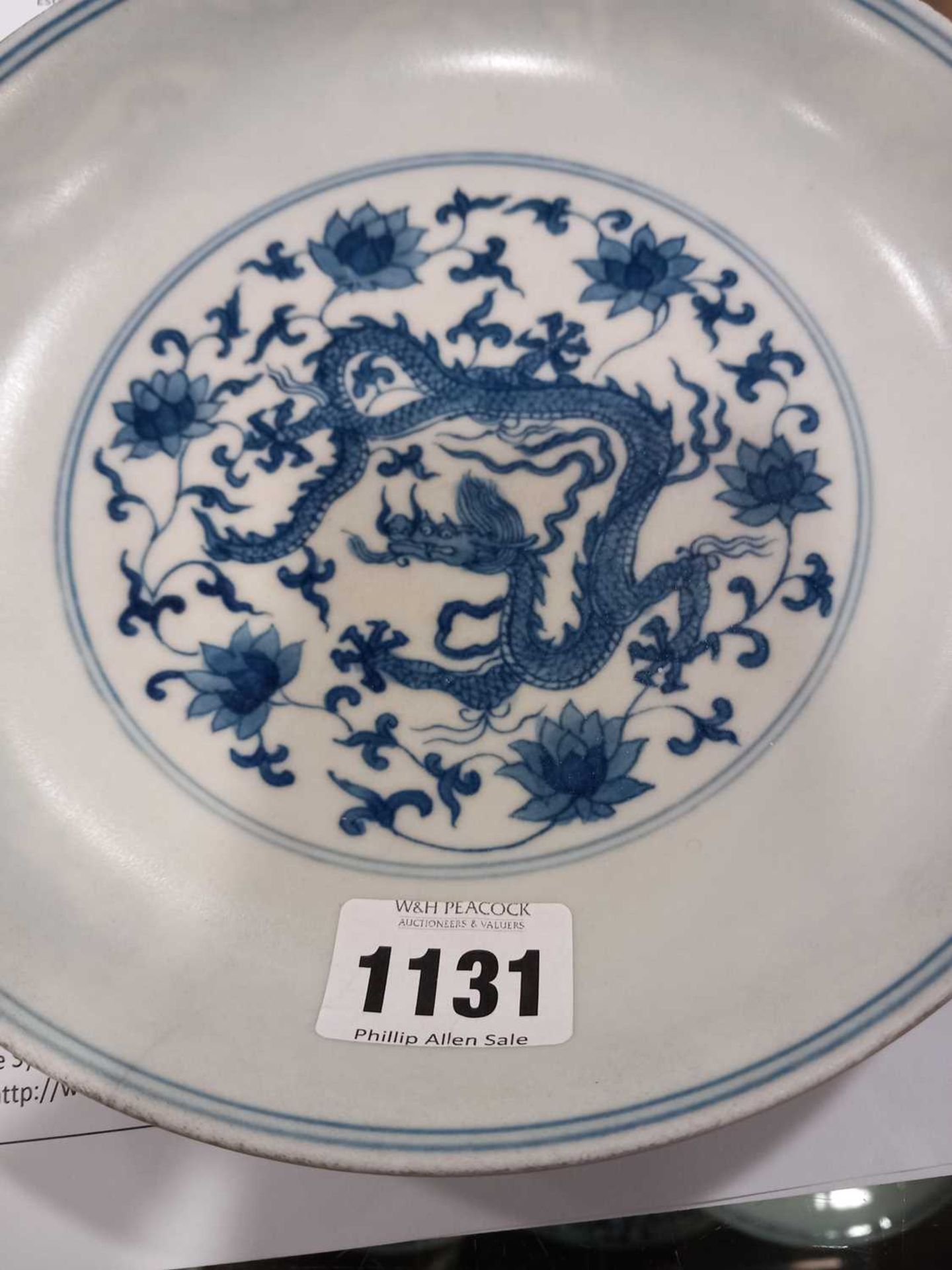 A Chinese blue and white shallow dish, centrally decorated with a dragon and lotus flowers, pseudo - Image 18 of 31