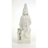 A Chinese blanc de chine figure modelled as Guanyin and her infant companion, h. 32 cm, w. 11 cm, d.