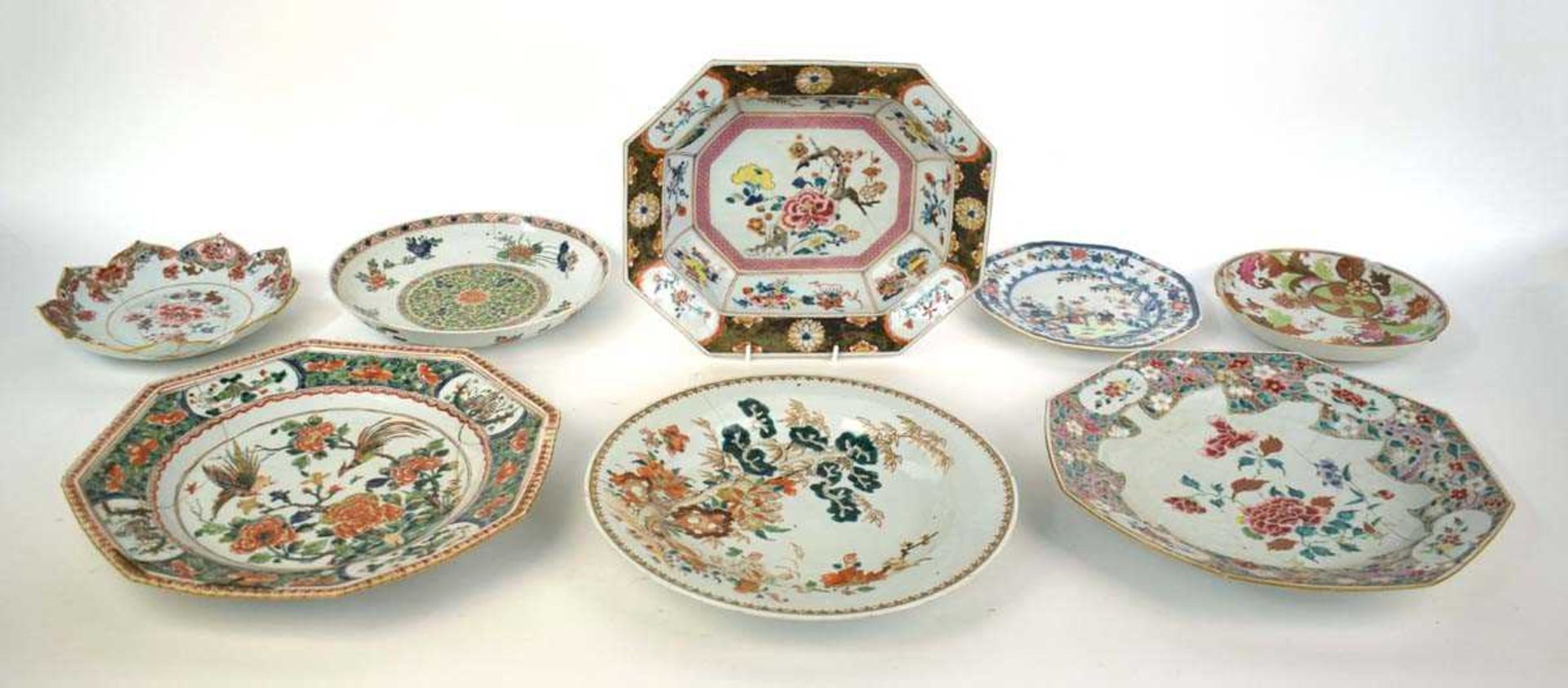 A Chinese shallow dish of octagonal form decorated with blossoming branches in the famille rose