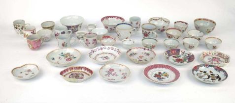 A large quantity of Chinese and famille rose decorated tea bowls, tea cups, saucers and saucer