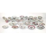 A large quantity of Chinese and famille rose decorated tea bowls, tea cups, saucers and saucer