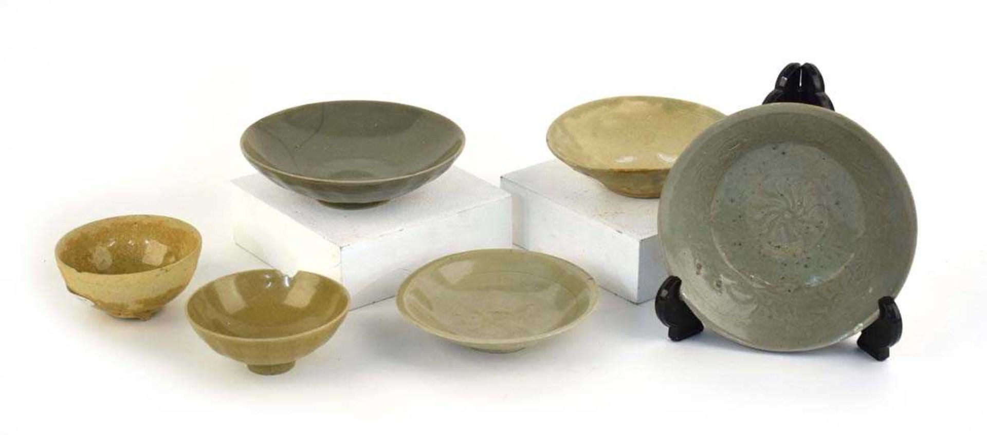 A Chinese celadon tea bowl of circular form repaired with the Kintsugi technique, d. 10.5 cm, h.4.