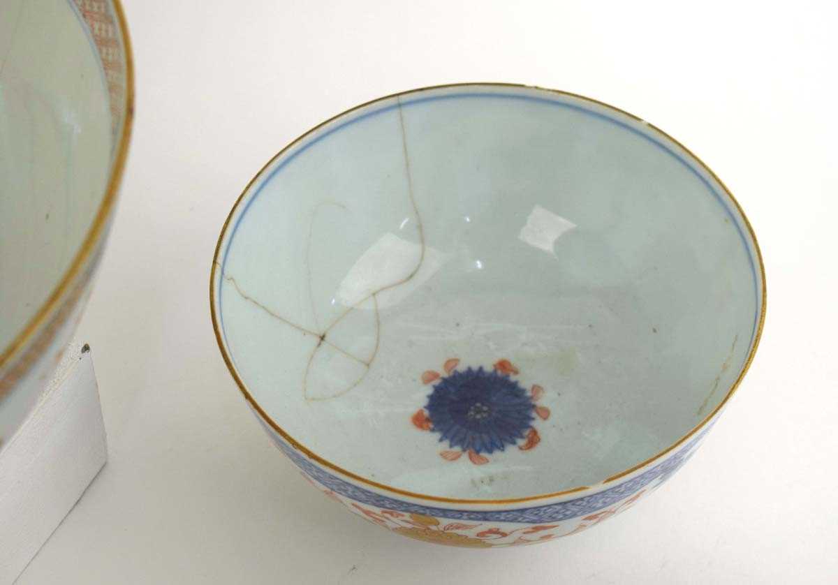 A Chinese bowl centrally decorated with a vase of flowers in the Imari palette, d. 25.5 cm, together - Image 5 of 5