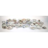 A large quantity of Chinese and other enamel and imari decorated tea bowls, tea cups, saucers and