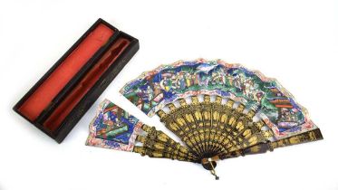 A Chinese lacquer work fan decorated with an extensive court scene, l, 28 cm when closed, w. 48.5 cm