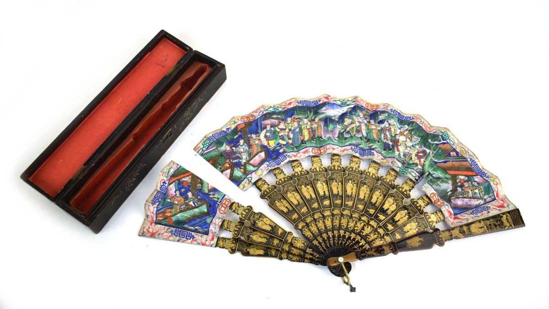 A Chinese lacquer work fan decorated with an extensive court scene, l, 28 cm when closed, w. 48.5 cm