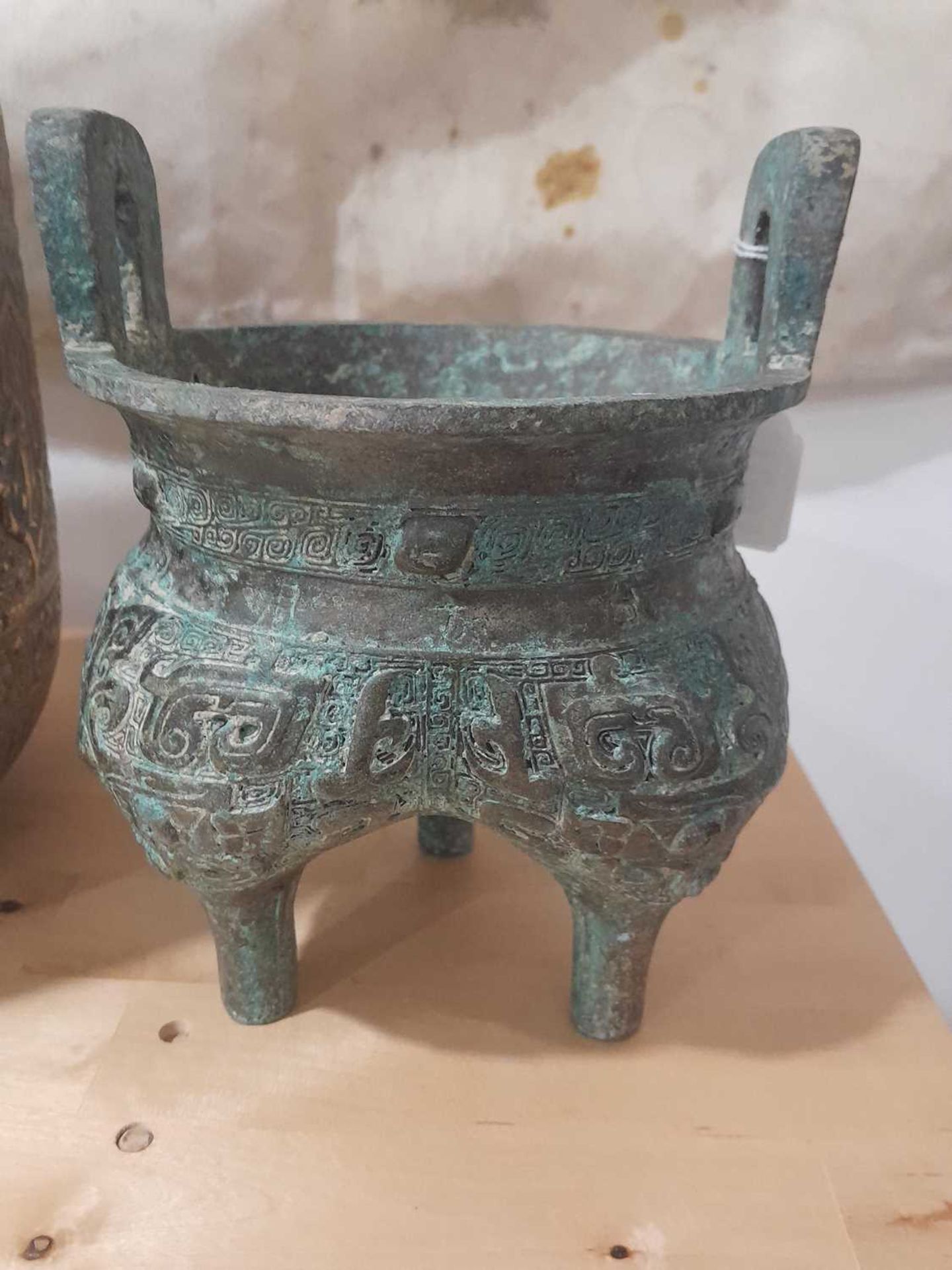 A Chinese green patinated bronze incense burner of archaic form, the triform base decorated with - Image 9 of 29
