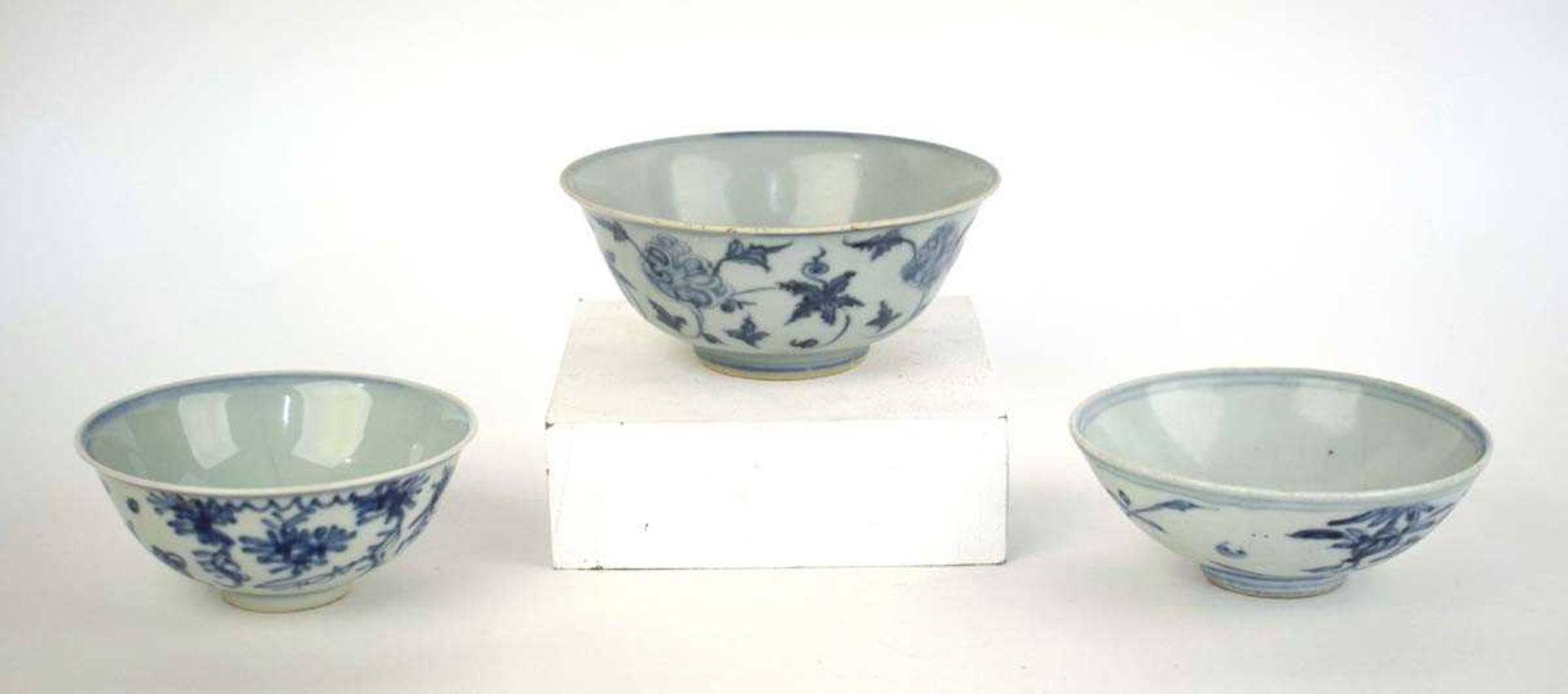 A Chinese blue and white bowl of flared form, externally decorated with scrolls of stylised