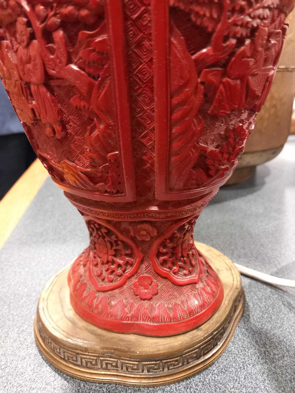 A Chinese cinnabar lacquer-type table lamp base, typically decorated with traditional landscapes and - Image 11 of 15