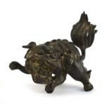 A Chinese brown patinated bronze figure modelled as a foo dog, h. 10.5 cm, d. 8.5 cm, 730 gms *