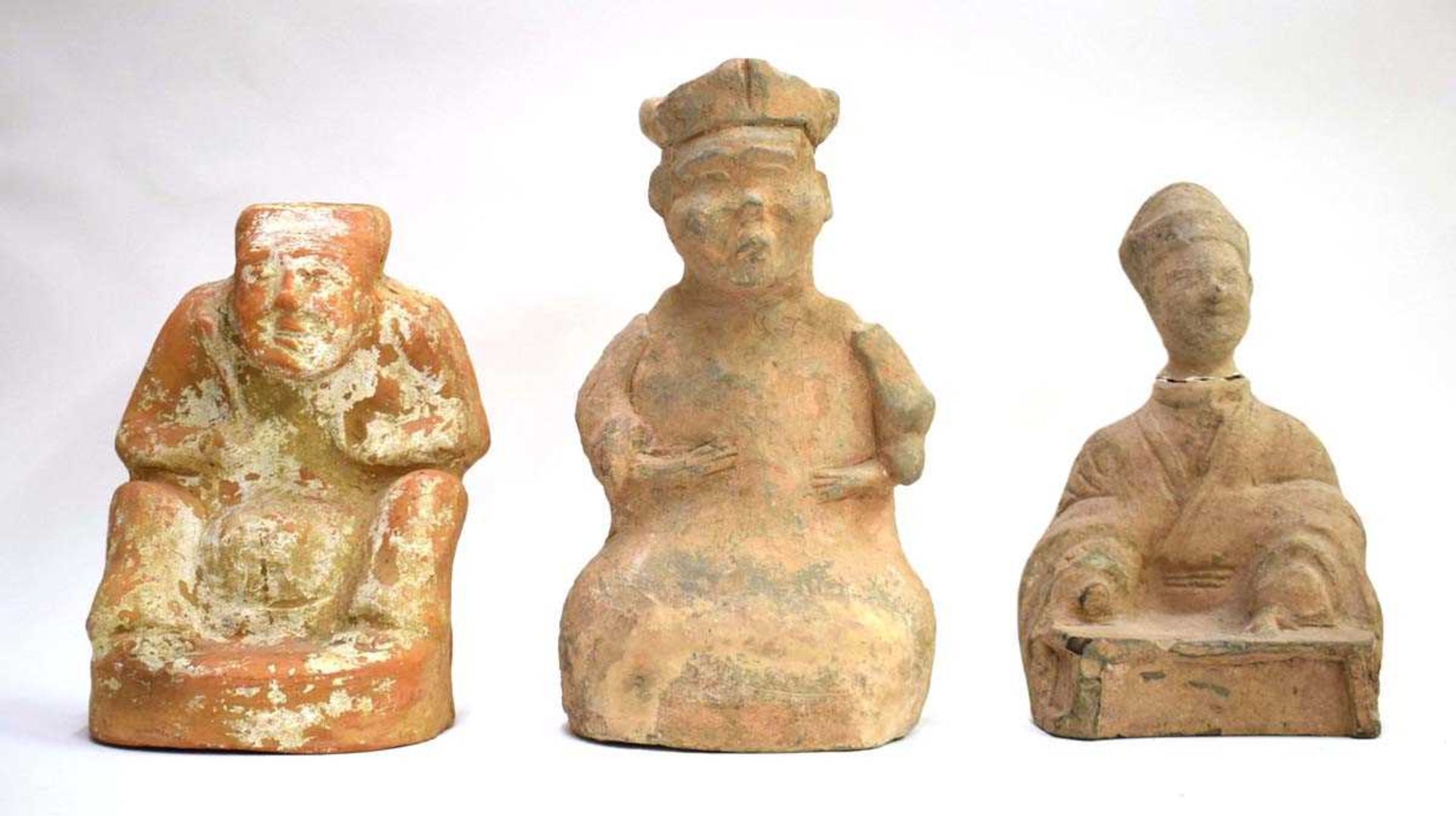 Eight Chinese pottery tomb and other figures of varying sizes, including seated examples, max h.