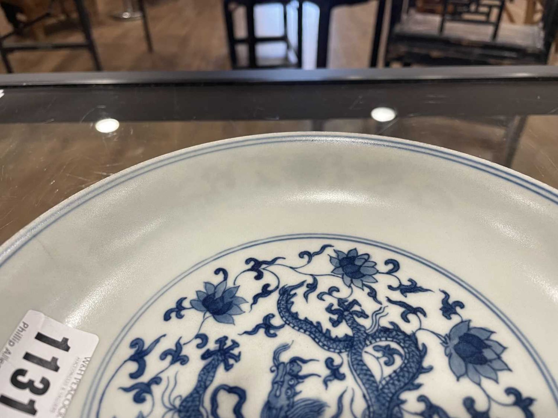 A Chinese blue and white shallow dish, centrally decorated with a dragon and lotus flowers, pseudo - Image 23 of 31