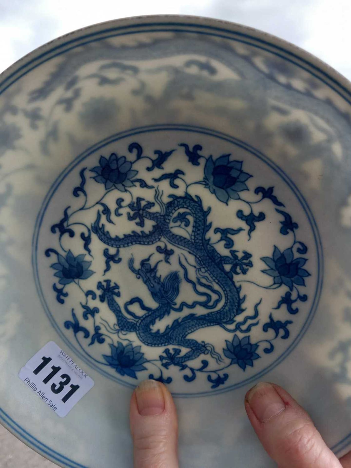 A Chinese blue and white shallow dish, centrally decorated with a dragon and lotus flowers, pseudo - Image 17 of 31