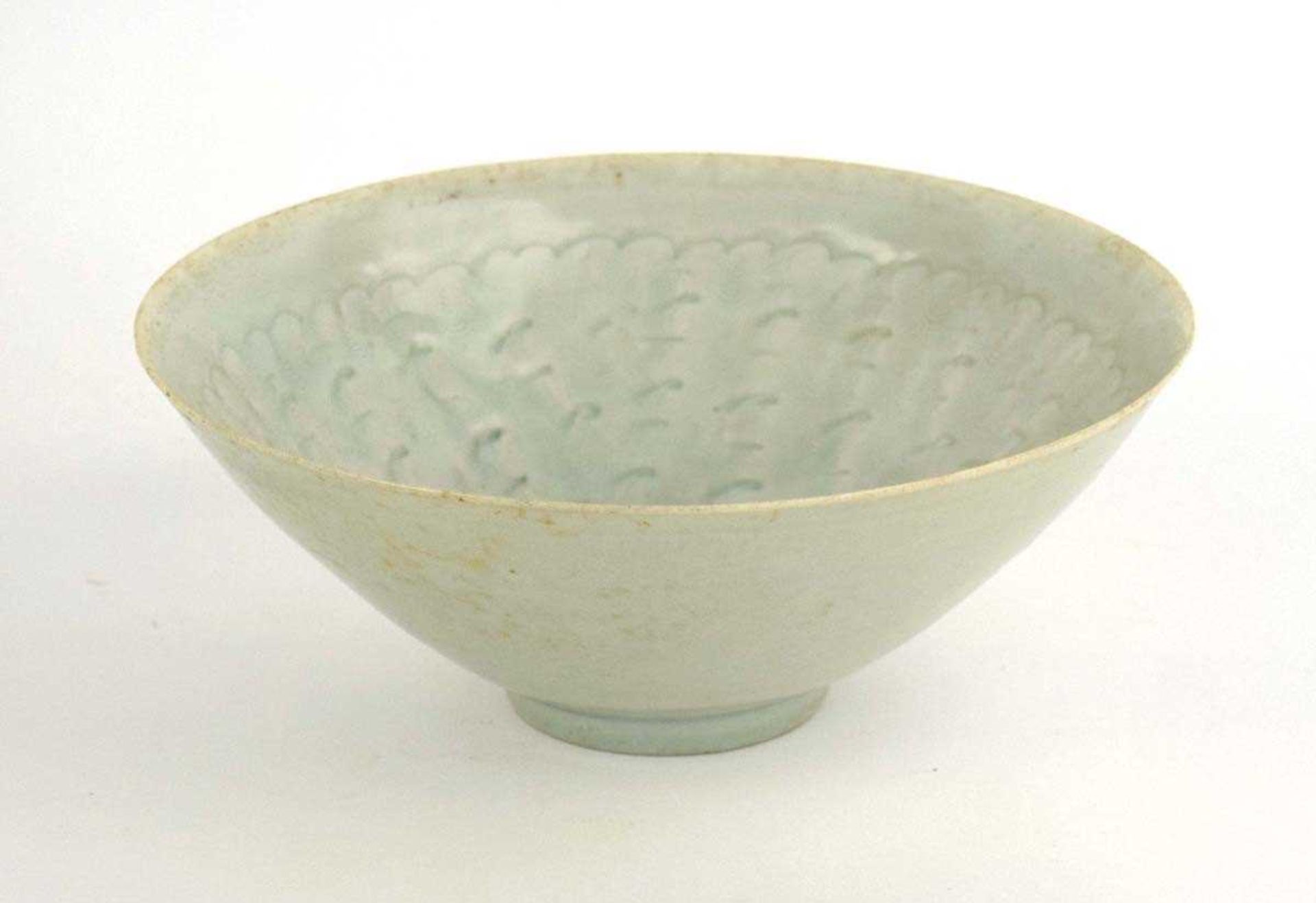 A Chinese celadon bowl of flared circular form, relief decorated with cloud like motifs, d. 20.5 cm, - Bild 2 aus 8