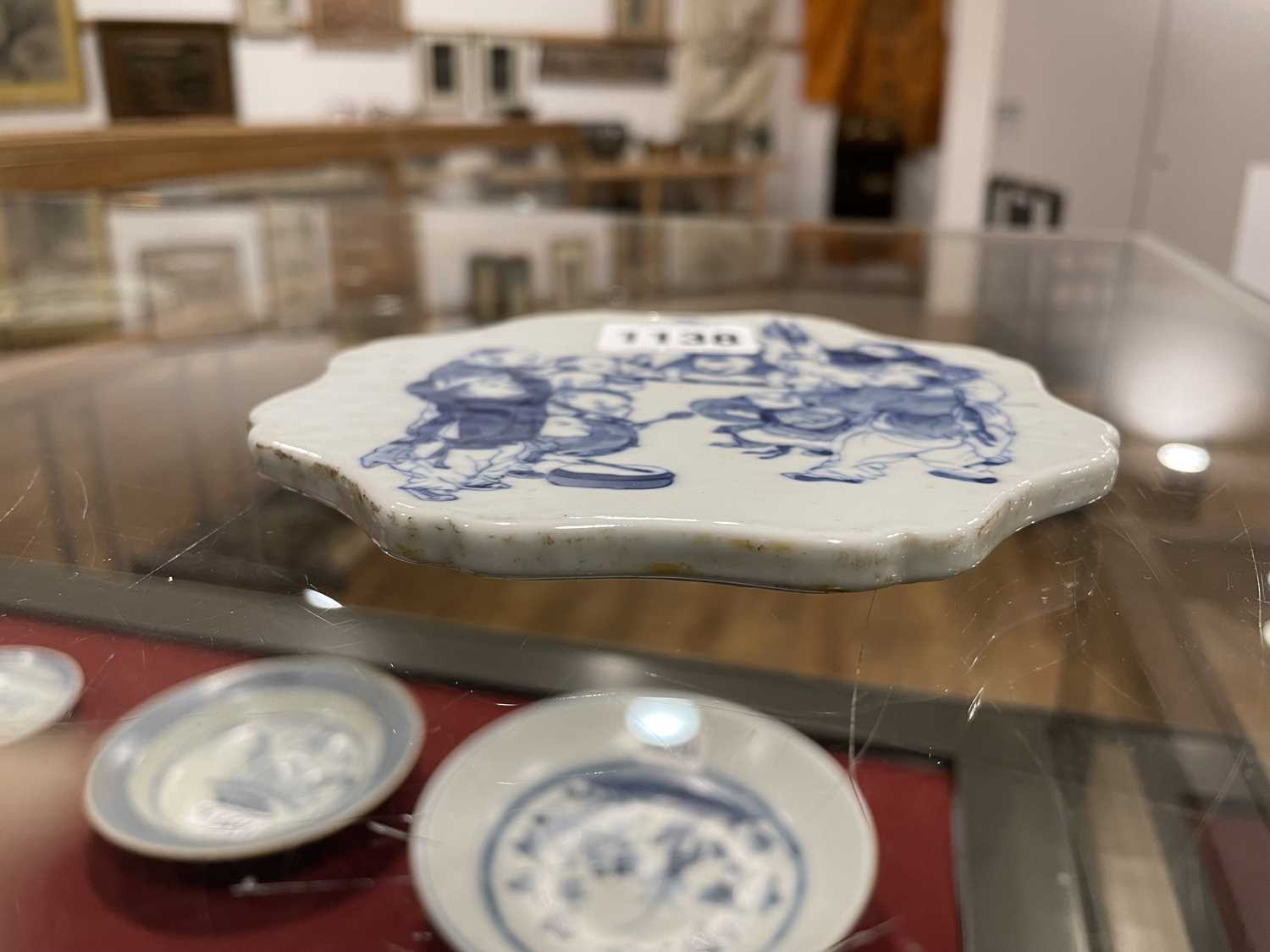 A Chinese blue and white plaque of flowerhead form decorated with children at play, set into a - Image 7 of 20