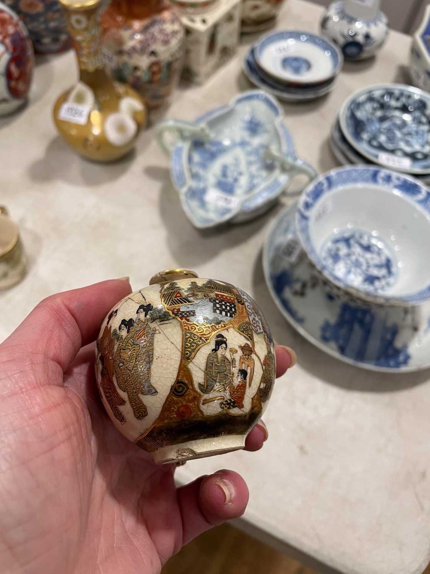 A Japanese satsuma bowl of flowerhead form, centrally decorated with peacocks within a landscape, - Image 15 of 41