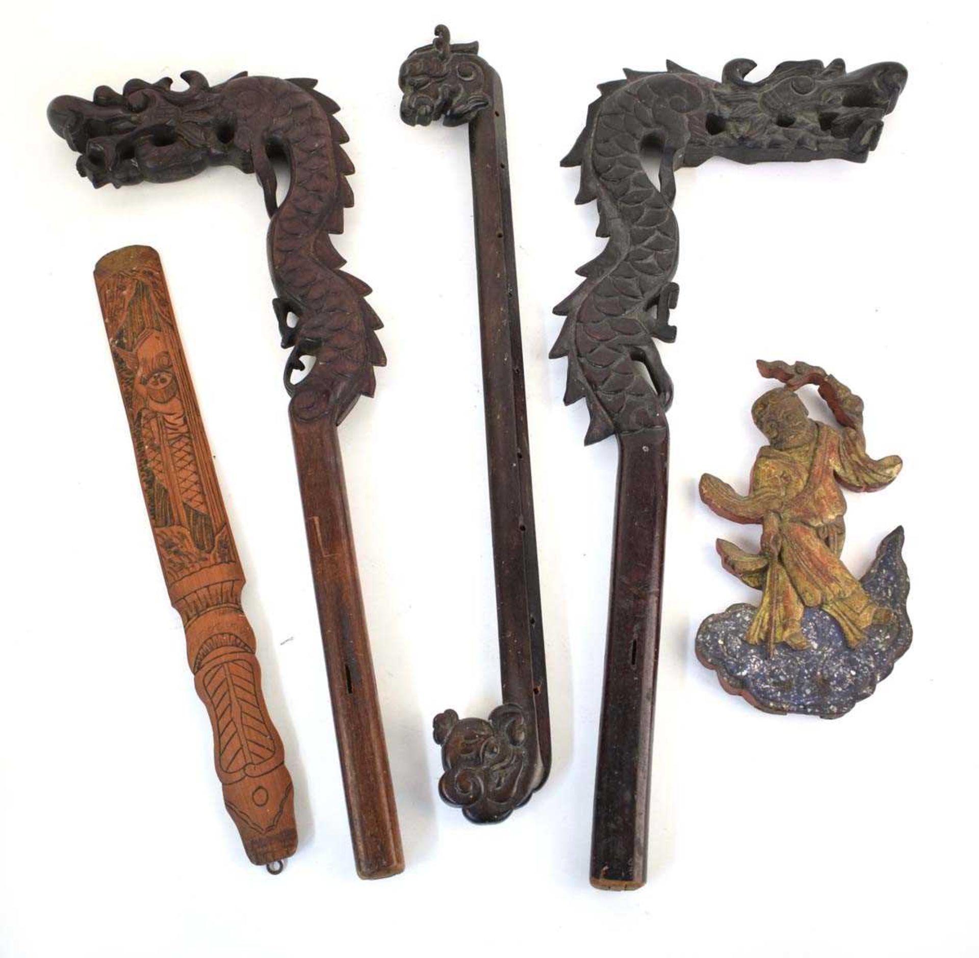A pair of Chinese carved hardwood frame sections, each modelled as a dragons head, l. 61 cm,
