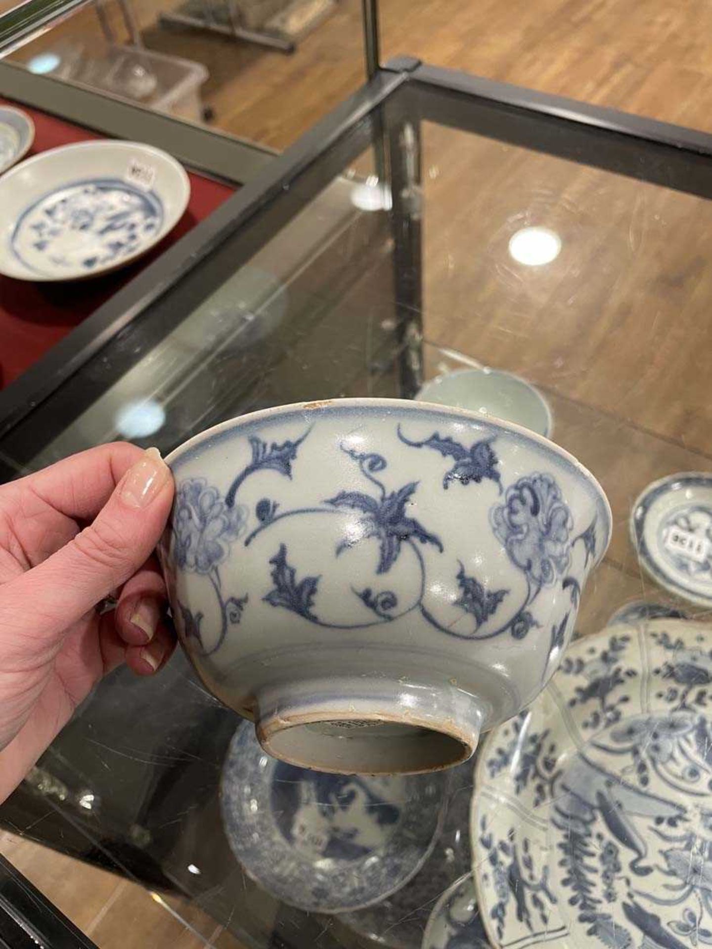 A Chinese blue and white bowl of flared form, externally decorated with scrolls of stylised - Image 10 of 22