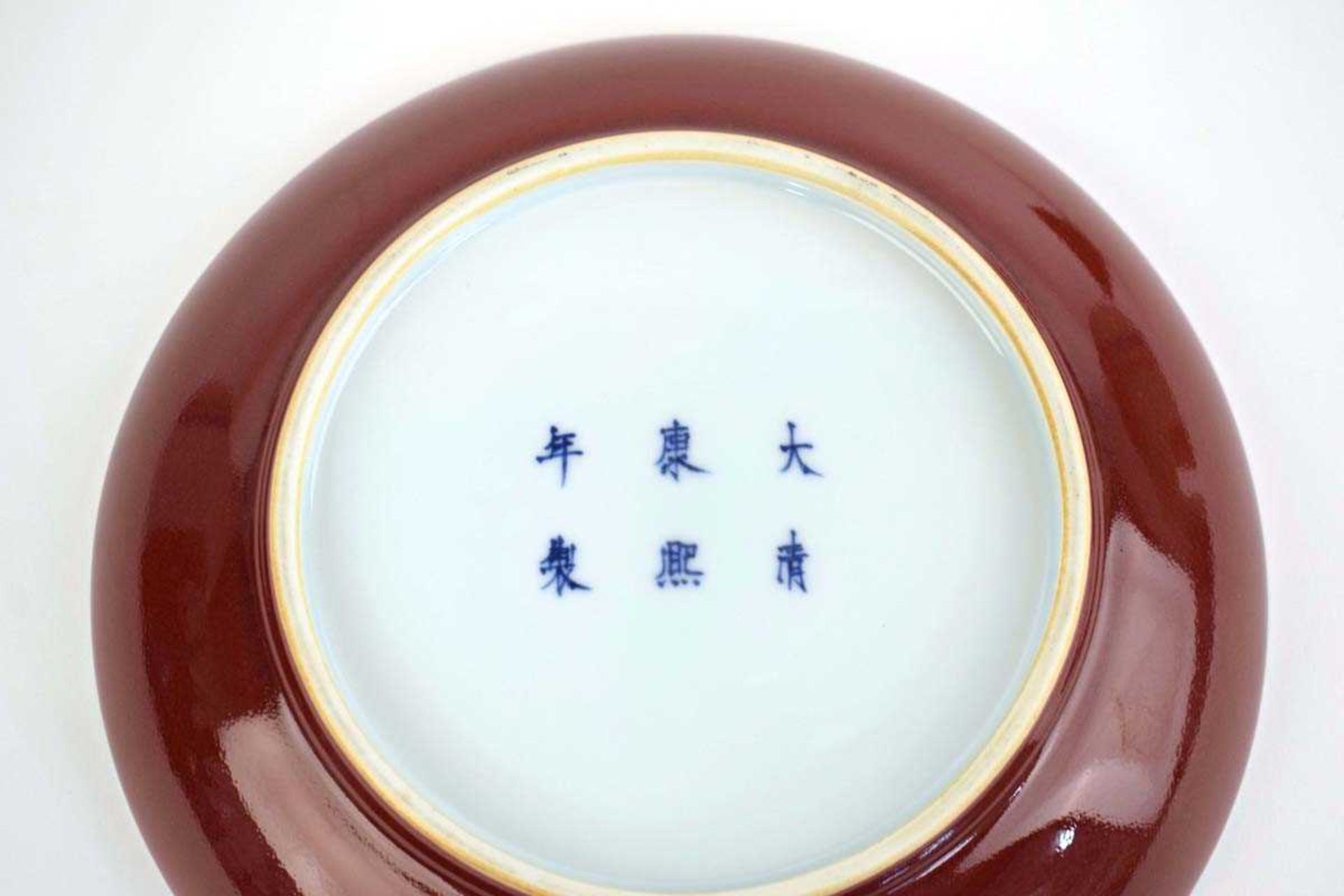 A Chinese sang de boeuf shallow dish, Kangxi mark to base, h. 4 cm, di. 22 cm, together with a - Image 4 of 26