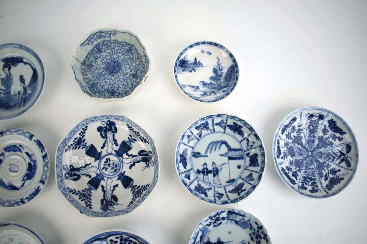 Eleven 18th century and later Chinese blue and white dishes and saucers including examples decorated - Image 3 of 8