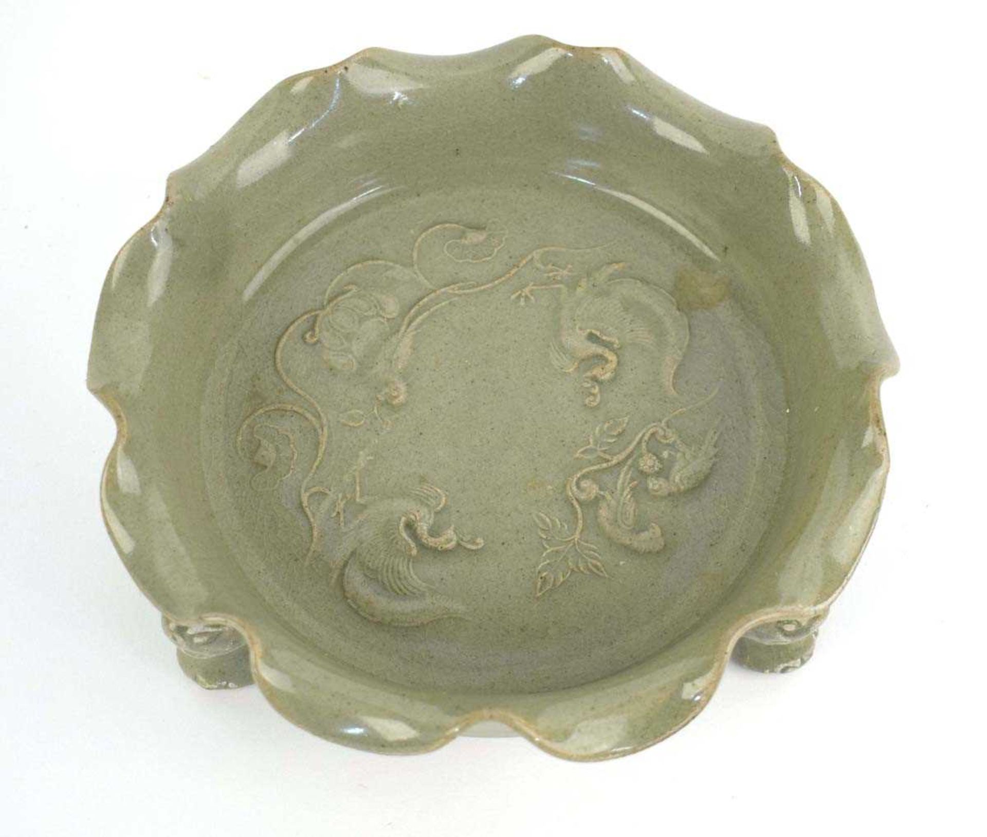 A Chinese celadon dish of scalloped circular form, relief decorated with exotic birds on three - Image 4 of 10