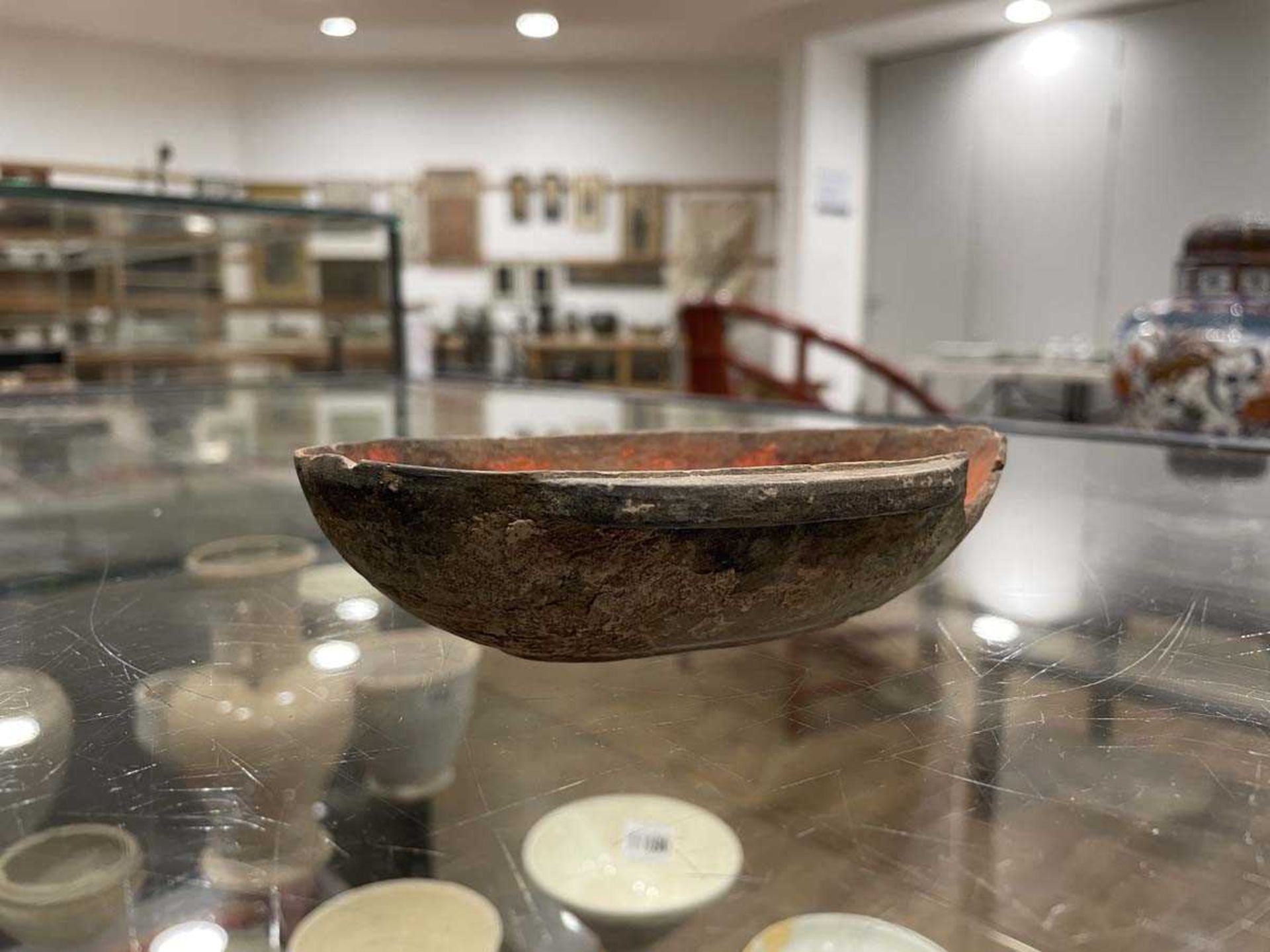 A Chinese archaic pottery ear cup decorated in a black glaze, l. 18 cm, boxed, together with two - Bild 4 aus 19