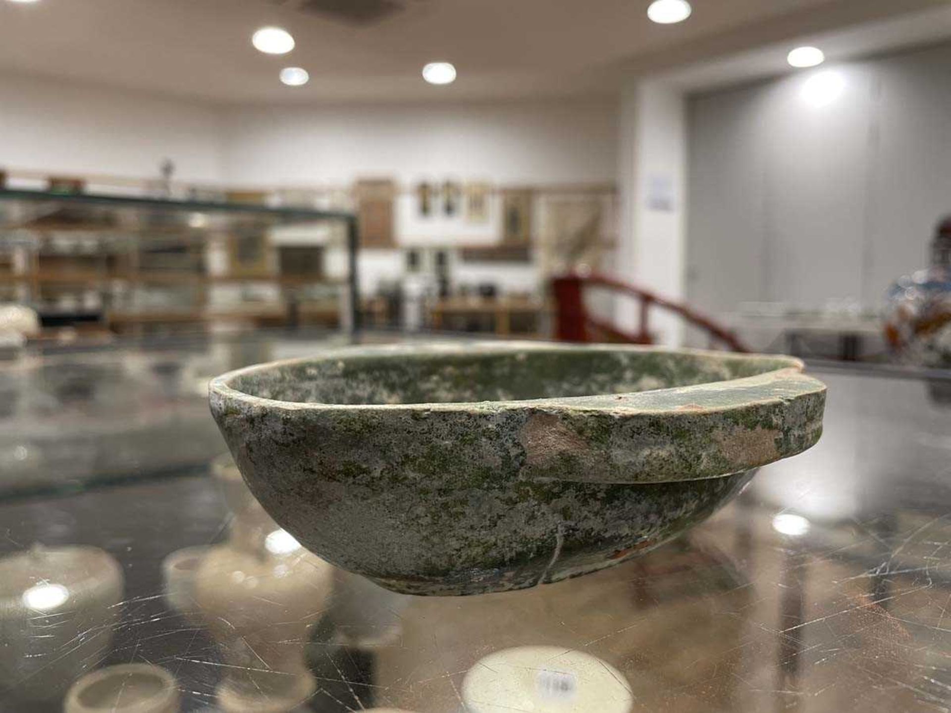 A Chinese archaic pottery ear cup decorated in a black glaze, l. 18 cm, boxed, together with two - Bild 11 aus 19